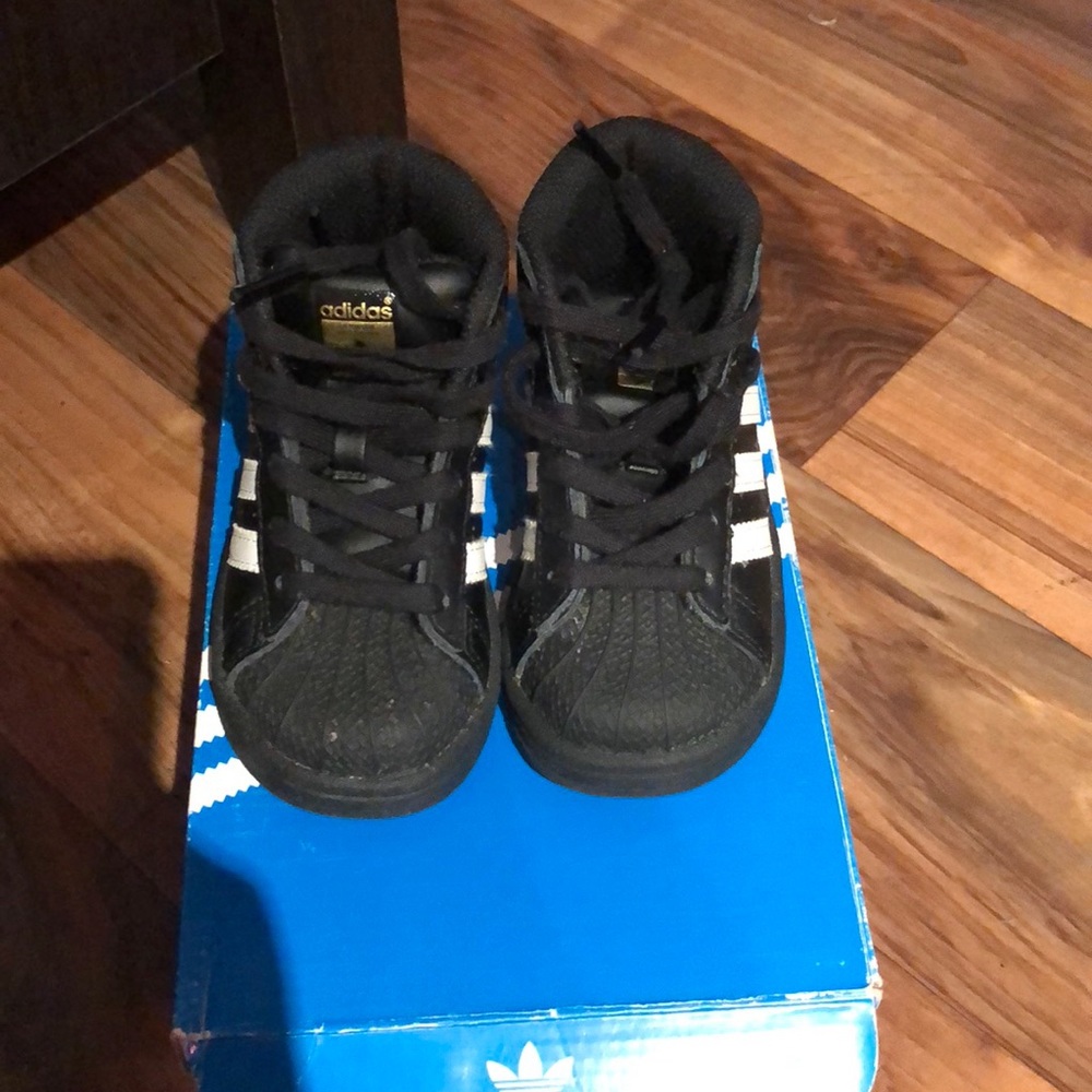 Adidas black and white high top shell toes